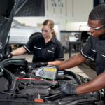 Mercedes-Benz technicians performing an oil change