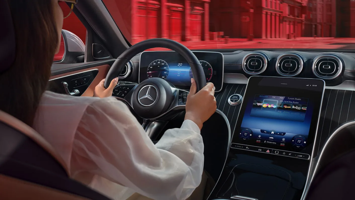 Woman driving a 2024 Mercedes-Benz C-Class sedan